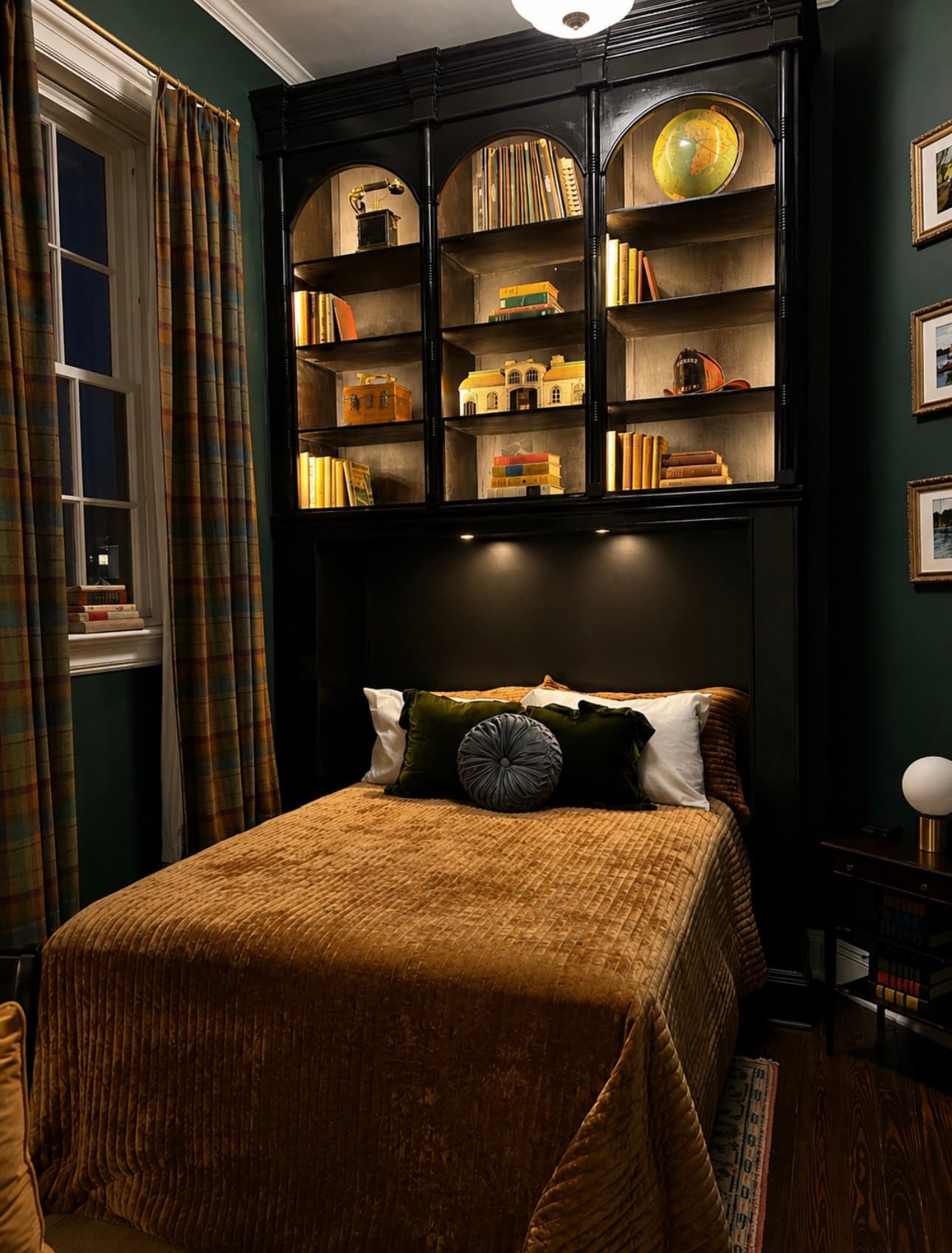The Librarian's Room at The Library Historic Hotel — queen bed with dark green walls and vintage shelving