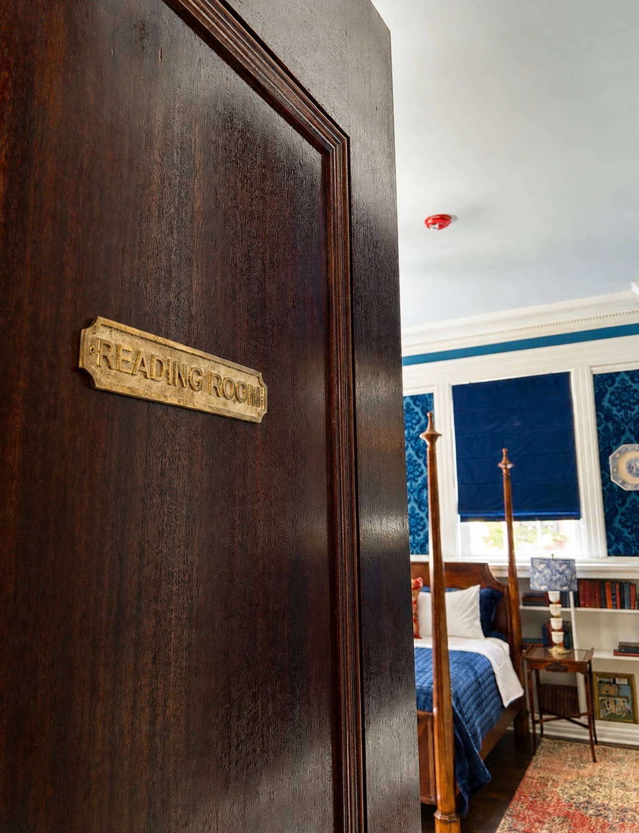 The Reading Room detail — historic bookcases and bedding